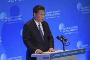 FILE - In this Monday, Sept. 28, 2015 file photo, China's President Xi Jinping speaks at a leaders' summit on peacekeeping at United Nations headquarters. The murders of Chinese citizens by Islamic militants in Syria and Mali place President Xi in a quandary: How can Beijing respond effectively without betraying its strict stance against intervention? The dilemma underscores the tension between Chinas desire to be seen as a leading global power and its desire to remain independent whiling shunning the U.S.-led Western political agenda. (AP Photo/Kevin Hagen, File)