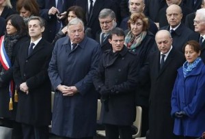 From the left, Paris mayor Anne Hidalgo, former French President Nicolas Sarkozy, Senate house speaker Gerard Larcher, Prime Minister Manuel Valls, Foreign Minister Laurent Fabius and Environment minister Segolene Royal wait for the start of a ceremony in the courtyard of the Invalides in Paris, Friday, Nov. 27, 2015. France is mourning and honoring those killed in the Nov. 13 attacks in a somber ceremony presided by French President Francois Hollande. (AP Photo/Francois Mori)