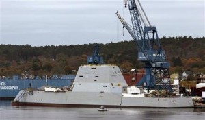FILE - In this Oct. 31, 2013 file photo the Navy's stealthy Zumwalt destroyer is built at Bath Iron Works, in Bath, Maine. The Navy's largest destroyer cuts an imposing figure: massive in size, with an angular shape, hidden weapons, and an unusual hull that fell out of favor a century ago in part because it can be unstable. How this unusual hull shape works in rough seas will be answered when the ship heads to sea in December. (AP Photo/Robert F. Bukaty, file)