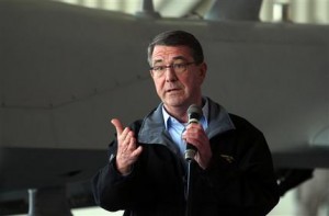 U. S. Defense Secretary Ash Carter addresses the U.S. troops at the Incirlik Air Base near Adana, Turkey, Tuesday, Dec. 15, 2015. Carter said the U.S. wants Turkey to better control its border with Syria, which could help block the flow of foreign fighters to the Islamic State group, and to more forcefully join the U.S.-led coalition "in the air and on the ground." (AP Photo)