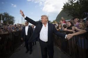 FILE - In this Friday, Sept. 25, 2015, file photo, Republican presidential candidate Donald Trump greets supporters before he delivers his message during a campaign rally at the state fair in Oklahoma City. Israel's Prime Minister Benjamin Netanyahu on Wednesday, Dec. 9, 2015, rejected Trump's recent statements about Muslims, saying Israel "respects all religions" as he faced calls to call off an upcoming visit by the Republican front-runner. (AP Photo/J Pat Carter, File)