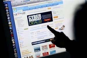 FILE - In this Monday, Nov. 29, 2010, file photo, a consumer looks at Cyber Monday sales on her computer at her home in Palo Alto, Calif. Retailers are rolling out online deals on so-called "Cyber Monday." But now that shoppers are online all the time anyway, the 10-year-old shopping holiday is losing some of its luster. (AP Photo/Paul Sakuma, File)