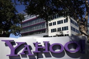 FILE - This Wednesday, Oct. 17, 2012, file photo, shows a sign in front of Yahoo headquarters in Sunnyvale, Calif. In discussions that began Wednesday, Dec. 2, 2015, Yahoos board is mulling an activist shareholders demand to sell the Internet services that define the company to avoid paying more than $10 billion in taxes on its gains from a lucrative investment in Chinas Alibaba Group. (AP Photo/Marcio Jose Sanchez, File)